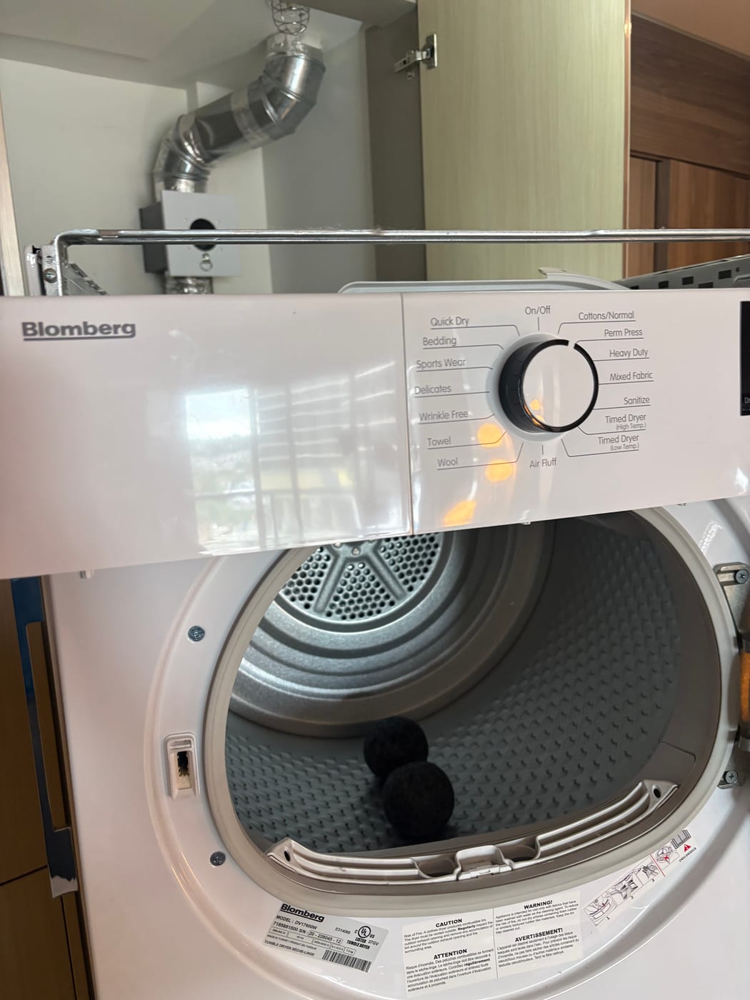 Illuminated dryer drum during an appliance service visit